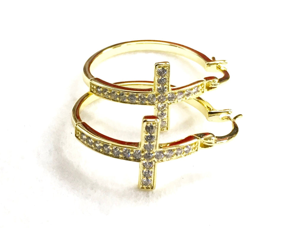 Gold cross hoop earrings with round pavé cross centerpiece and hinged hoop