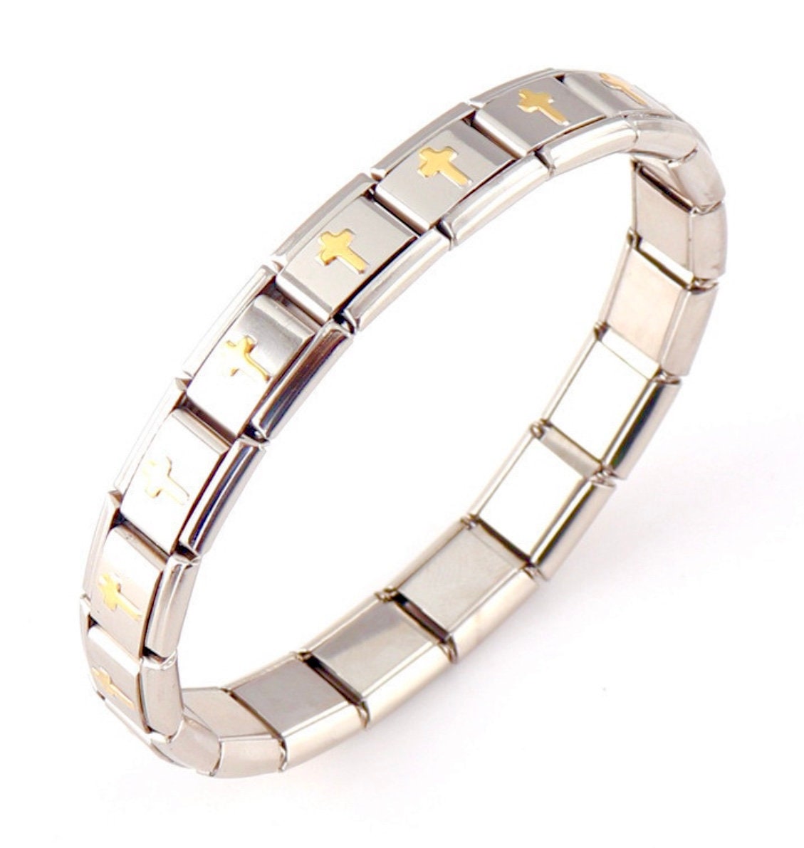 Silver stretch bracelet cuff with gold-tone cross link bars, angled view