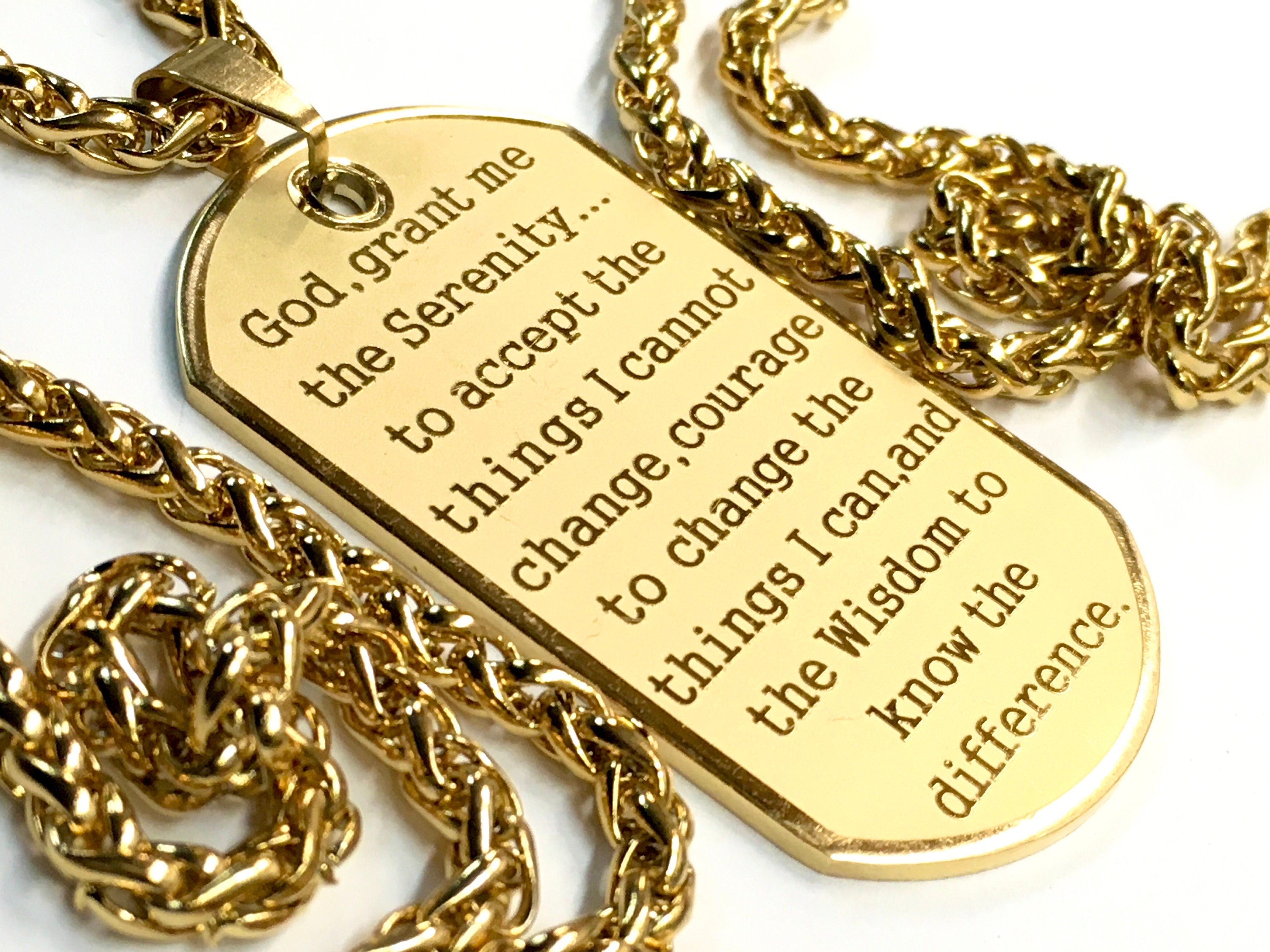 Gold dog tag necklace pendant with Serenity Prayer engraving and thick curb chain.