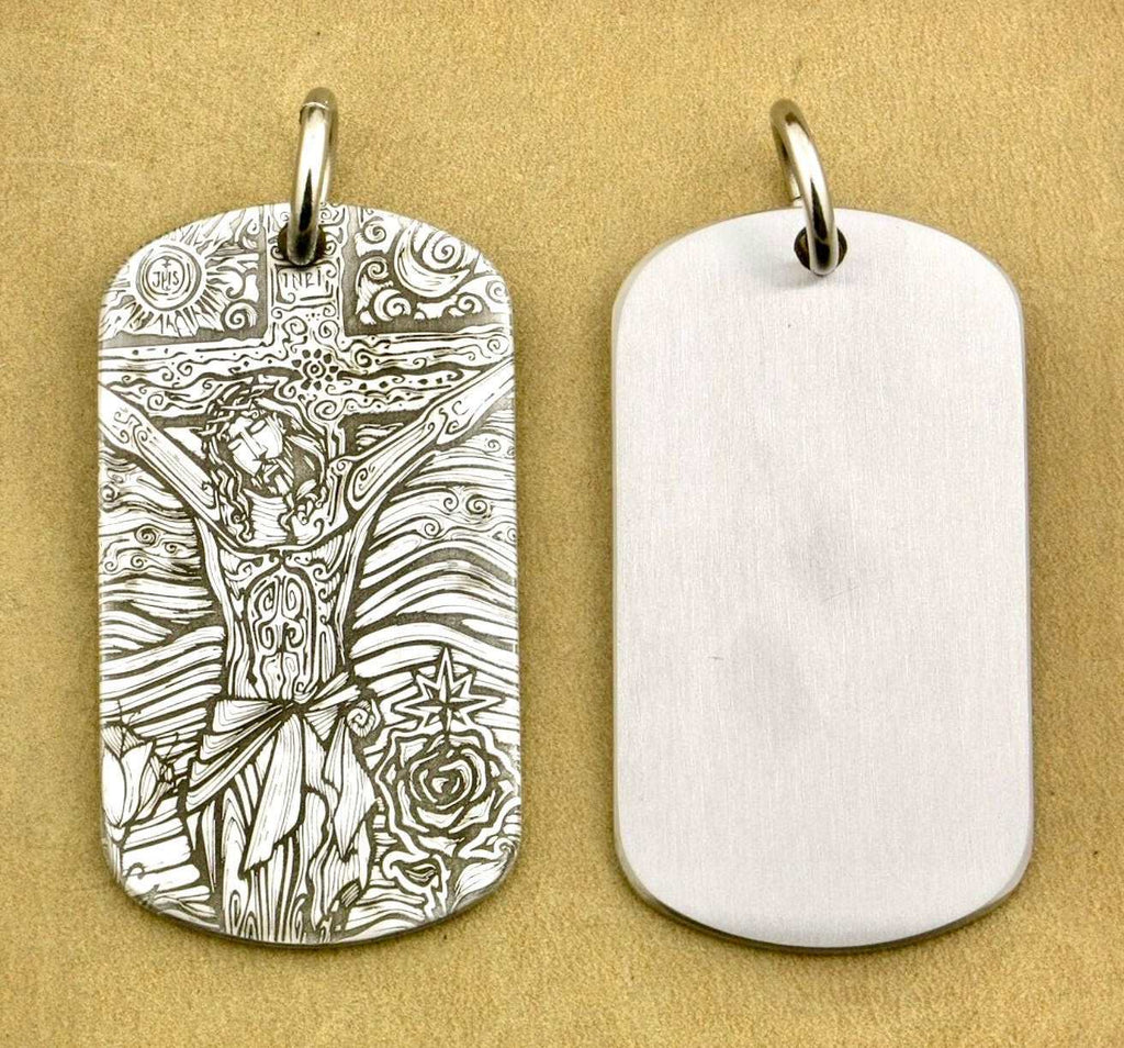 Engraved dog tag pendants with loops: one cross figure, one blank, silver-toned