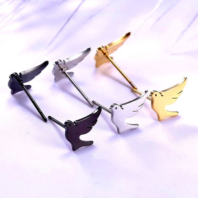 Dove stud earrings set with silver, gold, and black doves