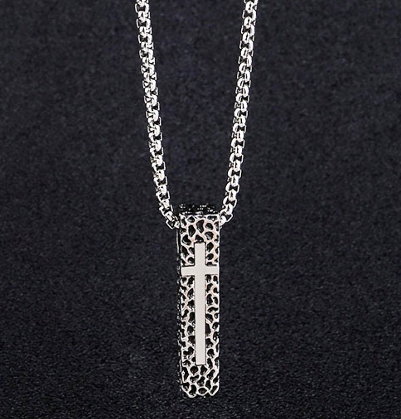 Rectangular crucifix pendant necklace with textured shield details, silver tone box chain