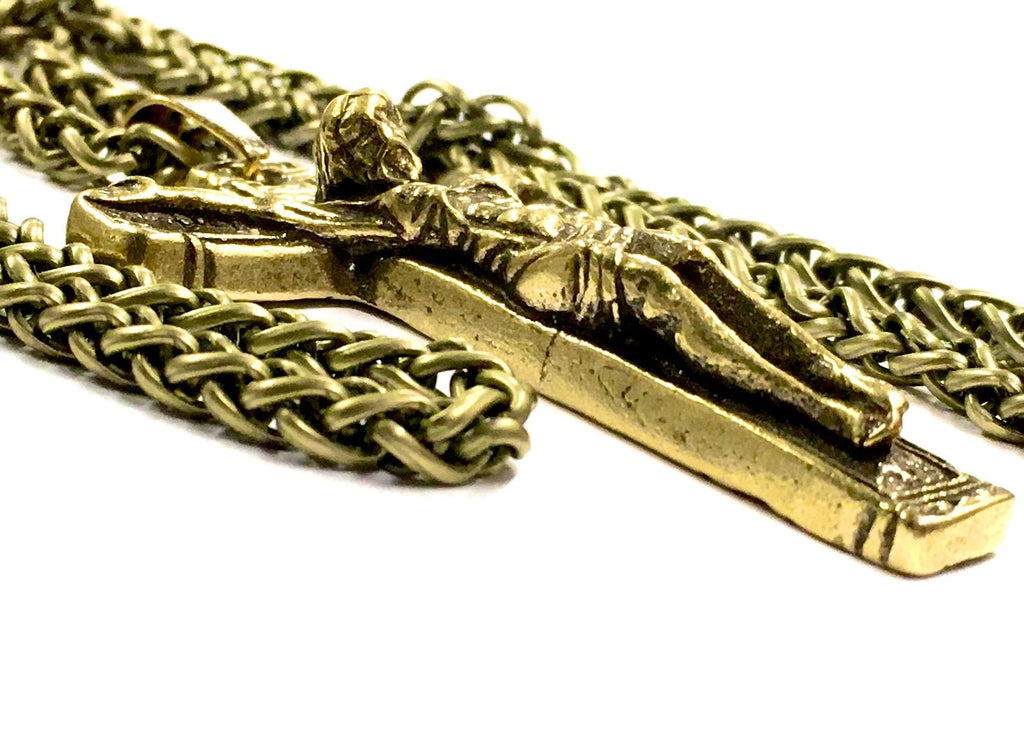 Bronze heavy link chain with crucifix pendant, close-up detail.