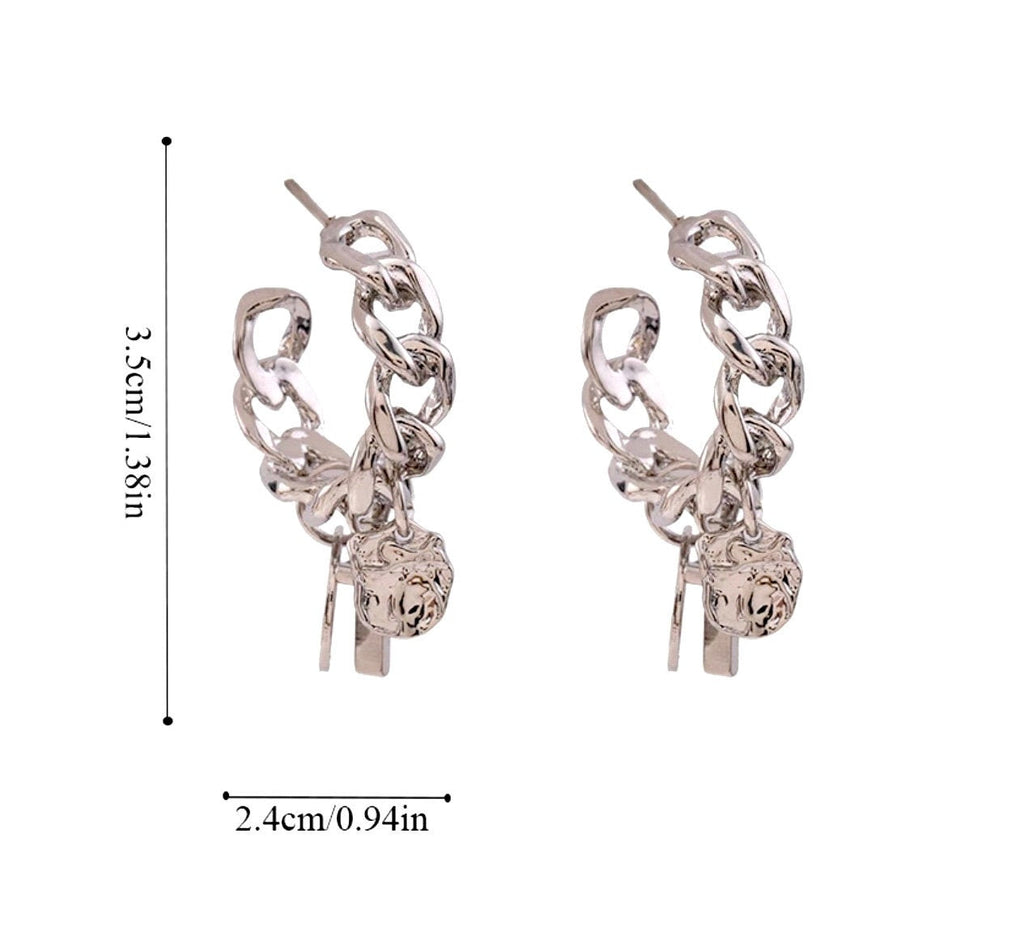 Silver curb chain hoop earrings with cross and round disc charms on hook backs