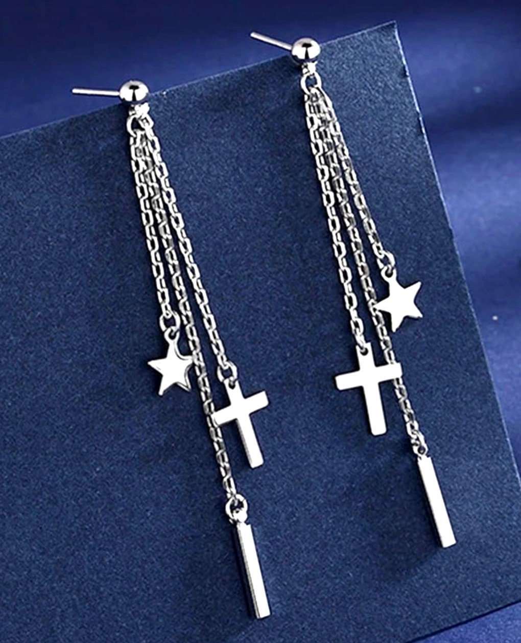 Silver long chain drop earrings with star, cross, and vertical bar charms