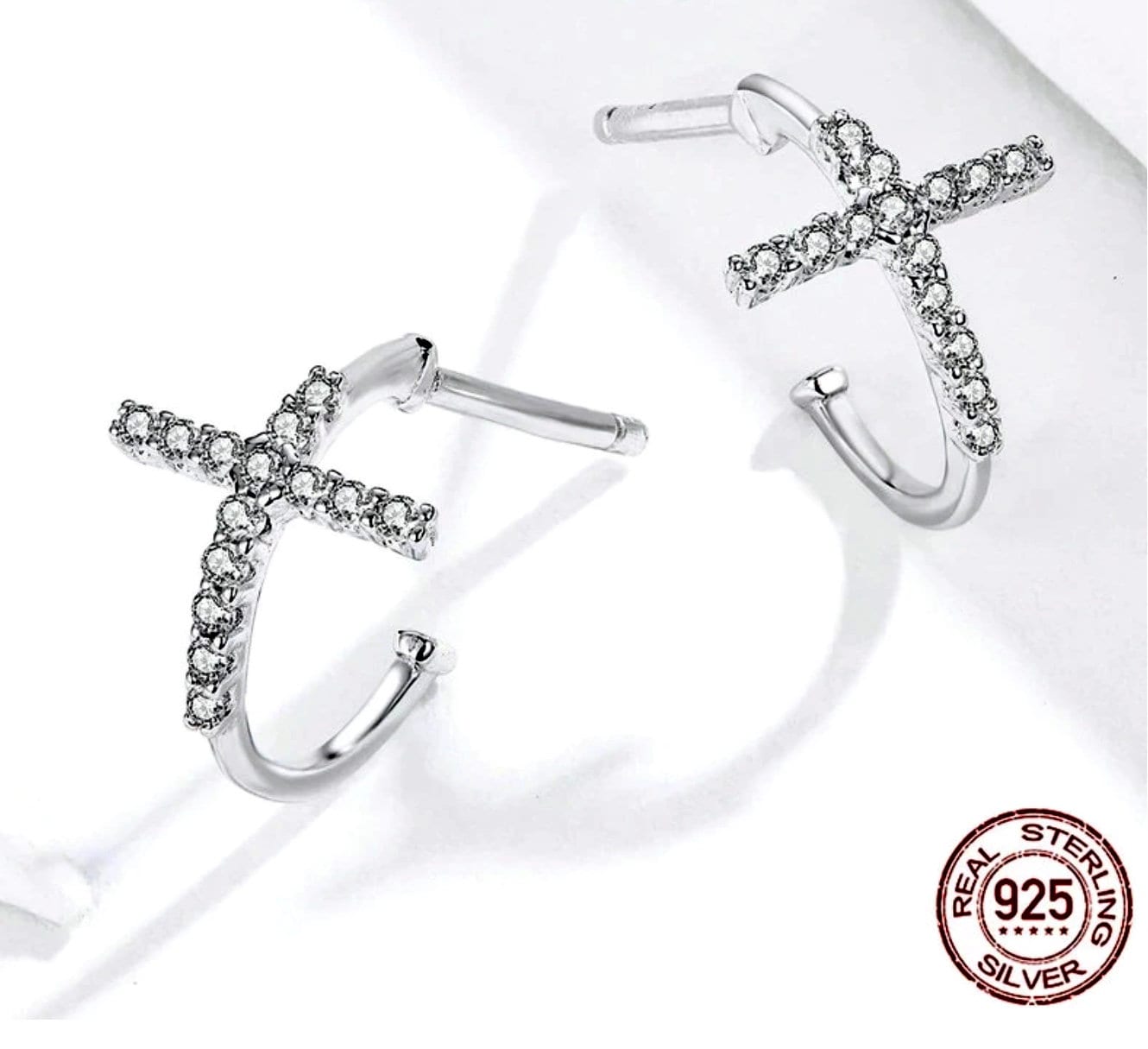 CZ cross cuff earrings with clear stone detail on silver-toned hoops, pair