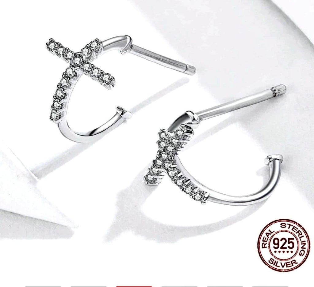 Sterling silver-toned cross cuff earrings with clear rhinestone settings, pair