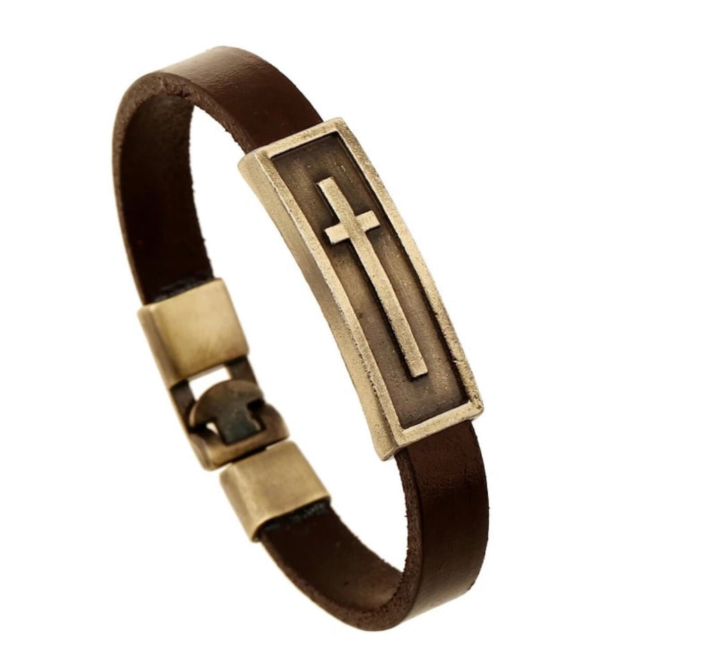 Brown leather cross bracelet with gold-tone center panel and cross emblem