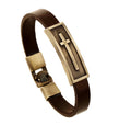 Brown leather cross bracelet with gold-tone center panel and cross emblem