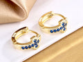 Gold cuff cross earrings with blue CZ cross motif, hinged small hoops