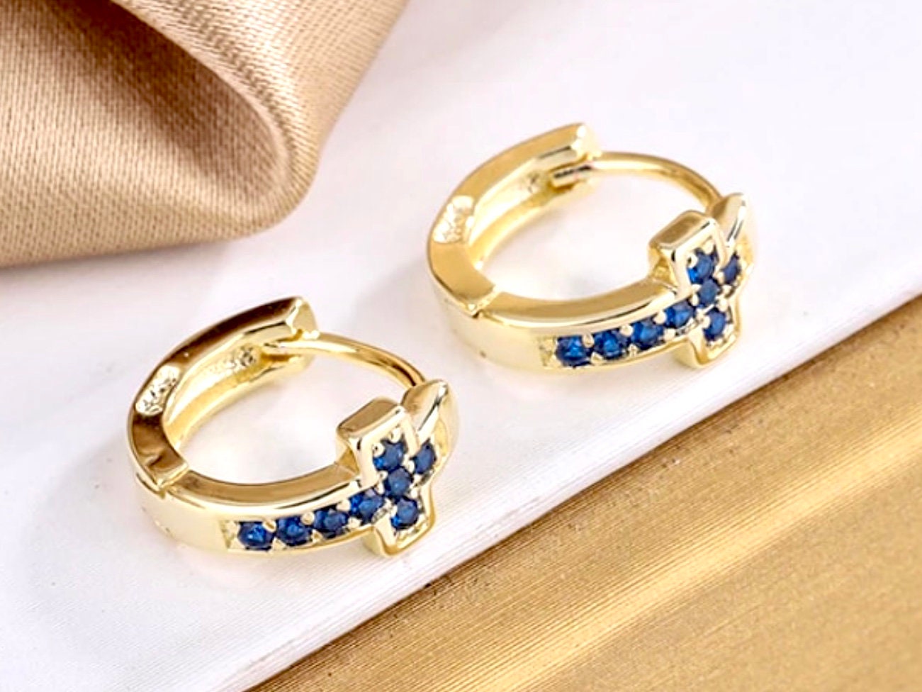 Gold cuff cross earrings with blue CZ cross motif, hinged small hoops