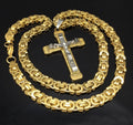 Two-tone crucifix necklace with gold curb chain and silver cross pendant