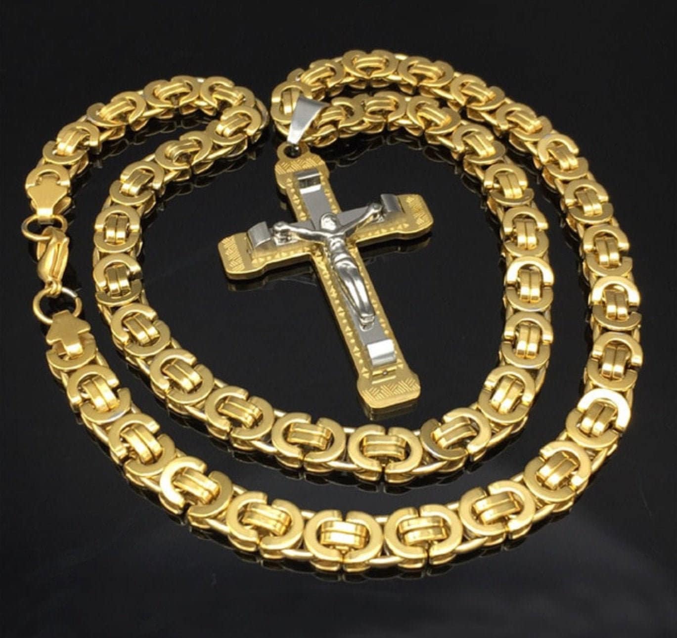 Two-tone crucifix necklace with gold curb chain and silver cross pendant
