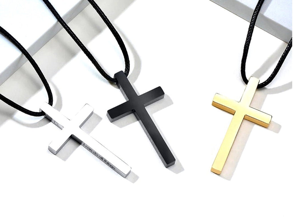 Men's cross necklaces on black cords, silver, black, and gold metal pendants