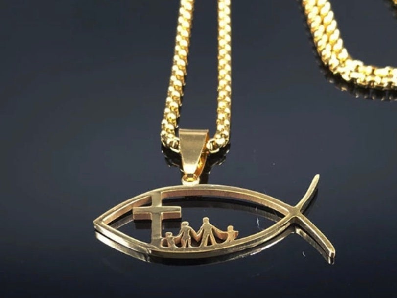 Fish pendant necklace with cross and family figures on gold-tone chain