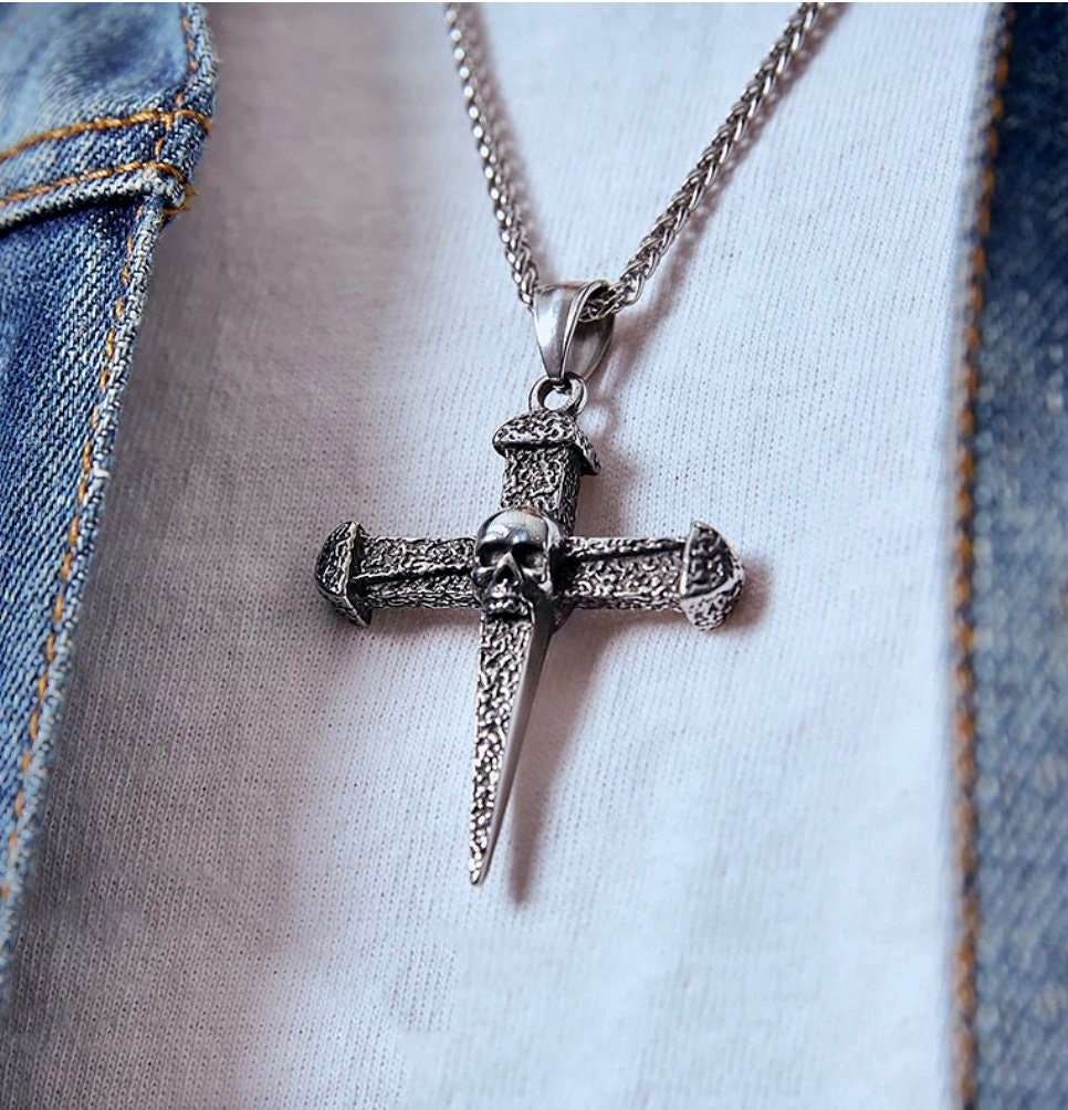 Hammered metal cross pendant necklace with turquoise oval stone and silver chain