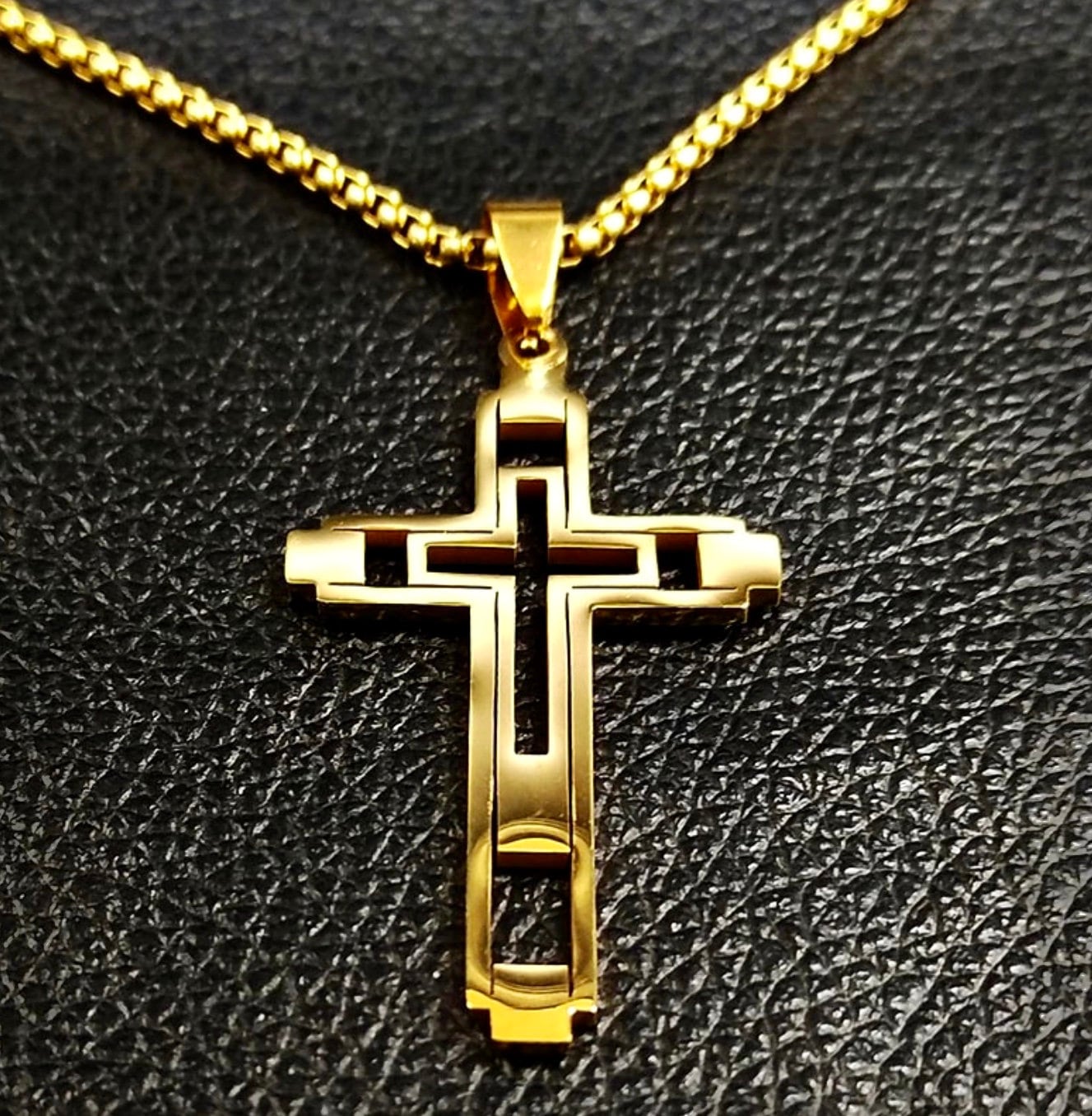 Gold cross pendant on link chain necklace