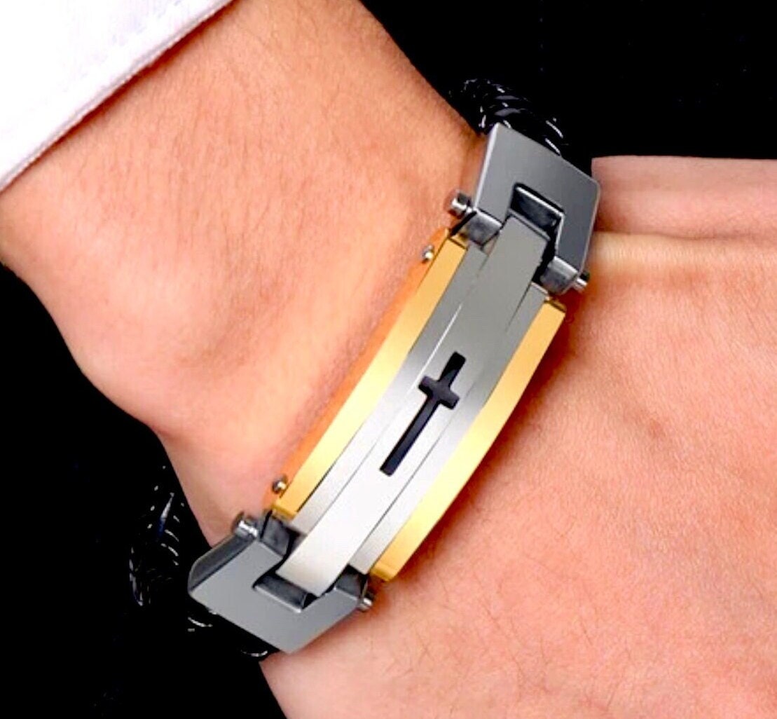 Men’s stainless steel bracelet with black leather braid and raised cross centerpiece
