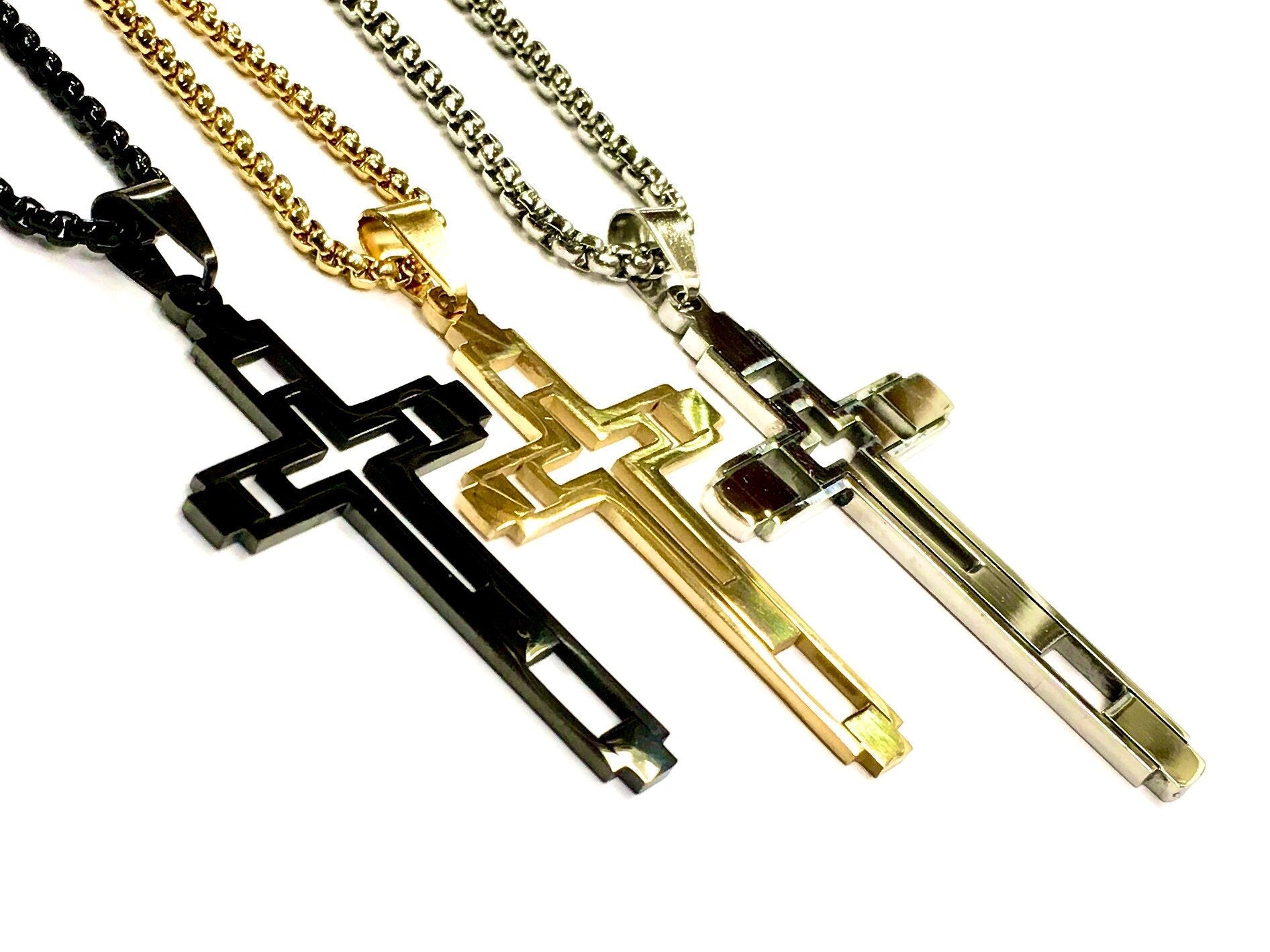 Multi-section cross necklace with black, gold, and silver cross pendants