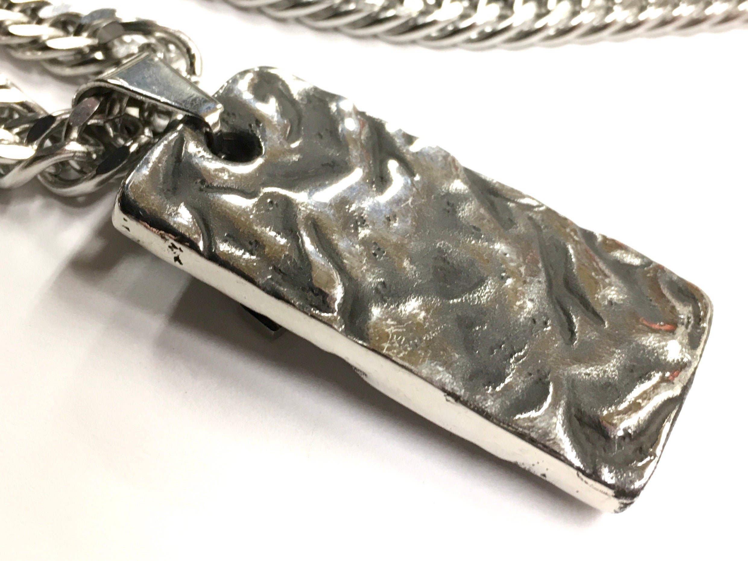 Textured metal dog tag charm with curb chain links