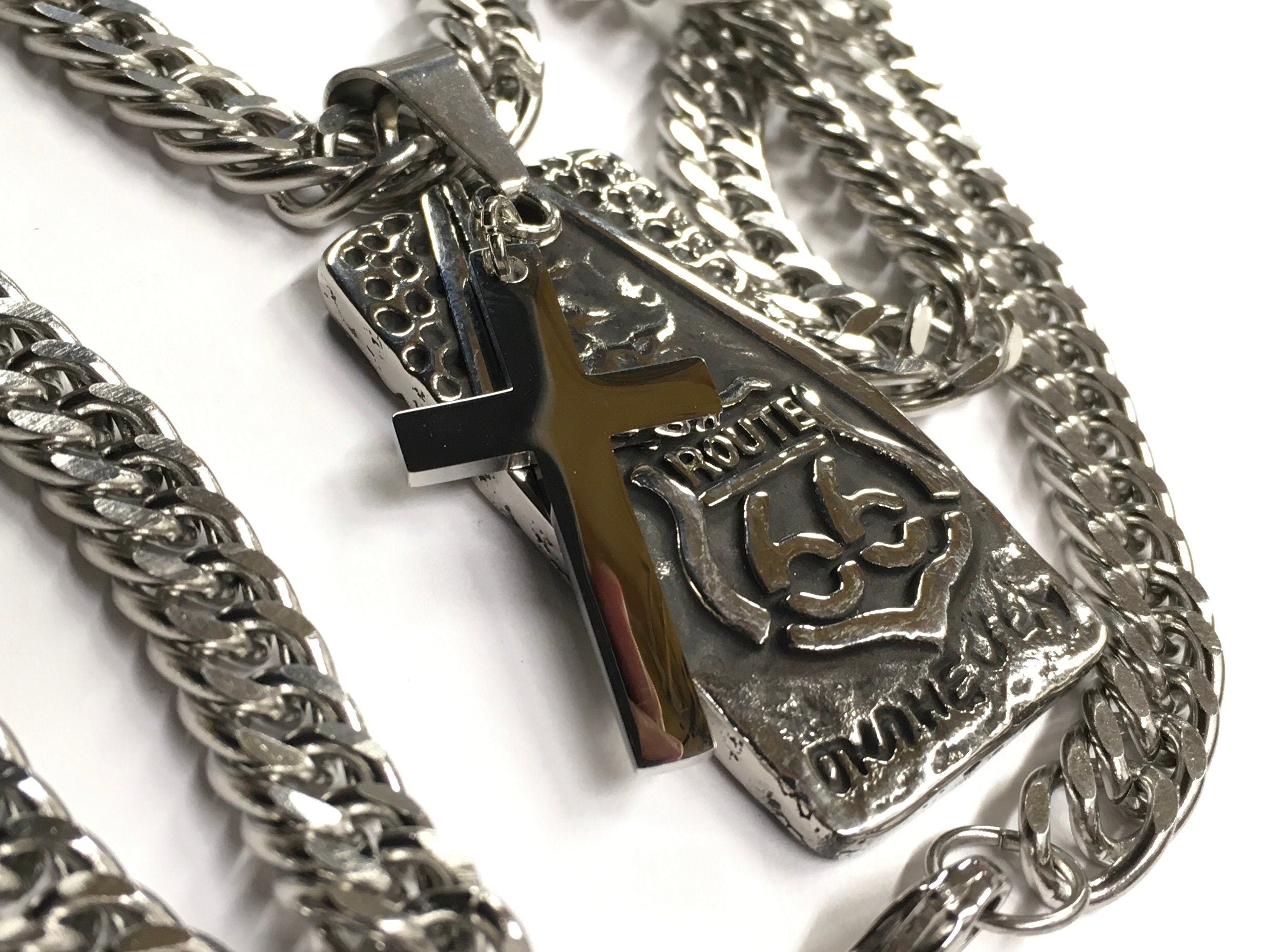 Dog tag pendant with cross and Route 66 emblem on curb chain