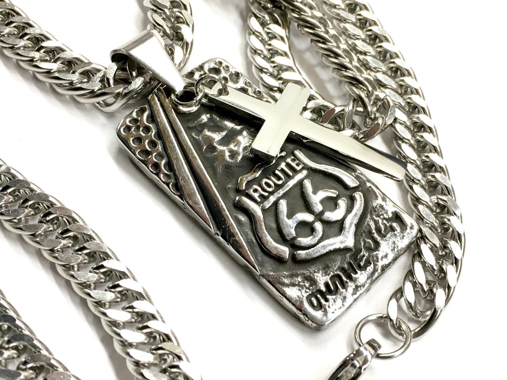Dog tag pendant with raised cross and Route 66 relief on curb chain
