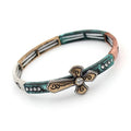Teal stretch bracelet cuff with gold cross charm and rhinestone accents