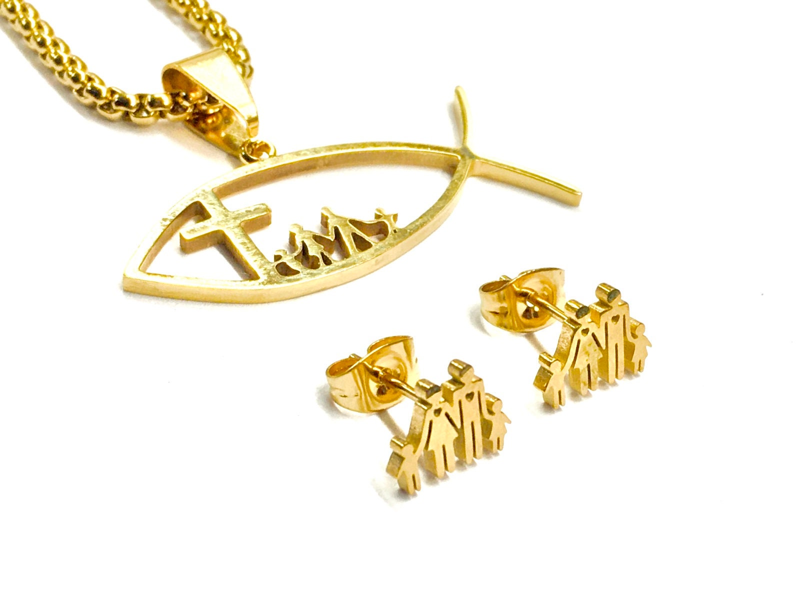 Gold-tone fish pendant necklace with cross and family figures on chain