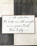 Framed wooden wall sign with white panel and black cursive quote, “oh and when”