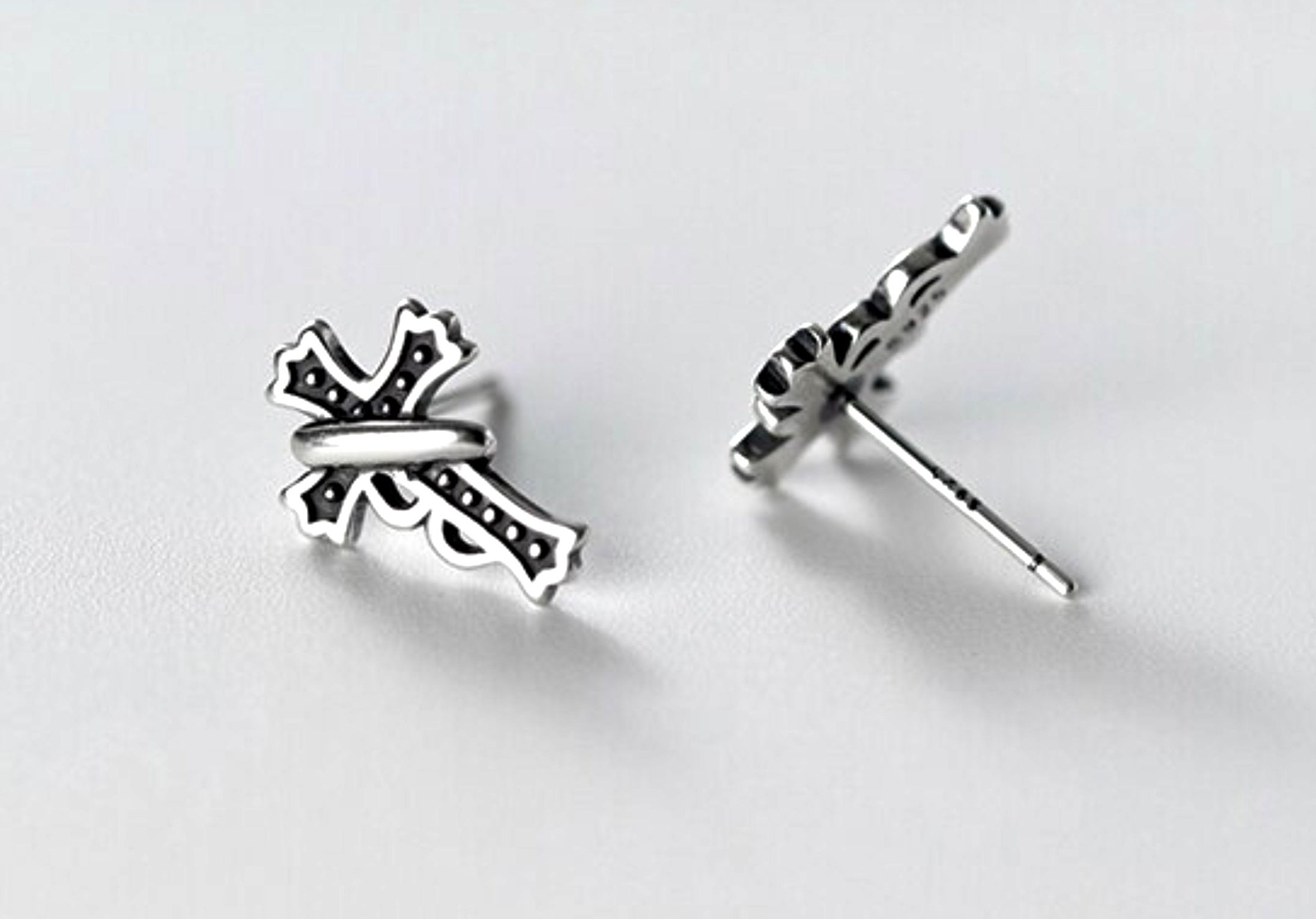 Sterling silver cross stud earrings, pair shown front view with butterfly backs