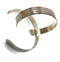 Stainless steel prayer cuff bracelet with engraved text and polished bangle design