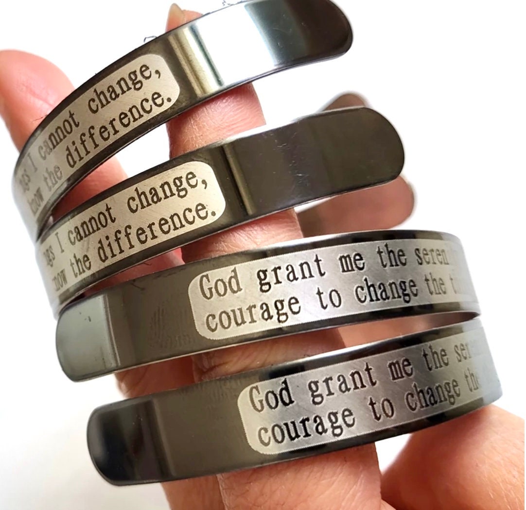 Stacked stainless steel prayer cuff bracelets with engraved serenity prayer text