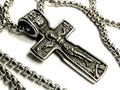 Silver crucifix cross pendant necklace with detailed metal figure and chain links
