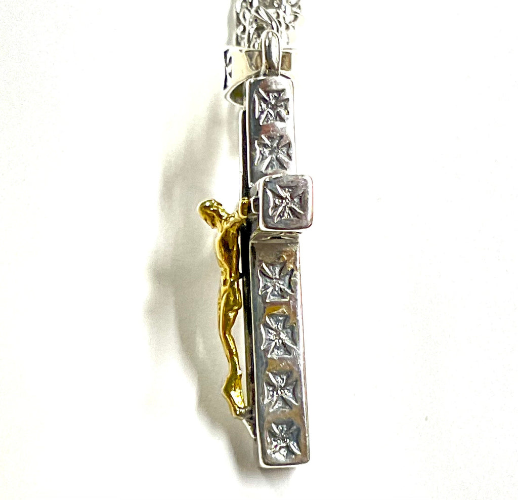 Two-tone crucifix cross pendant side view with gold-tone figure on silver chain
