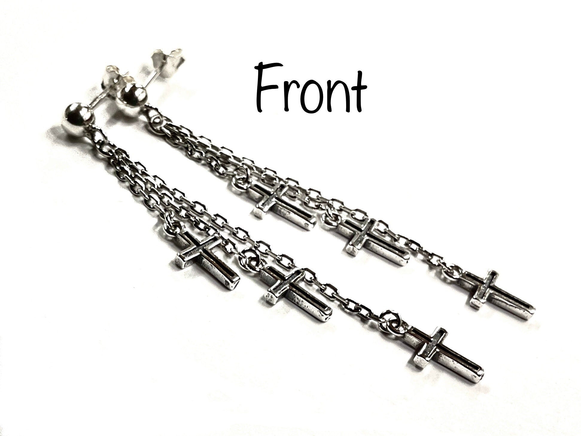 Front view: sterling silver cross dangle earrings with three chain strands and crucifix charms