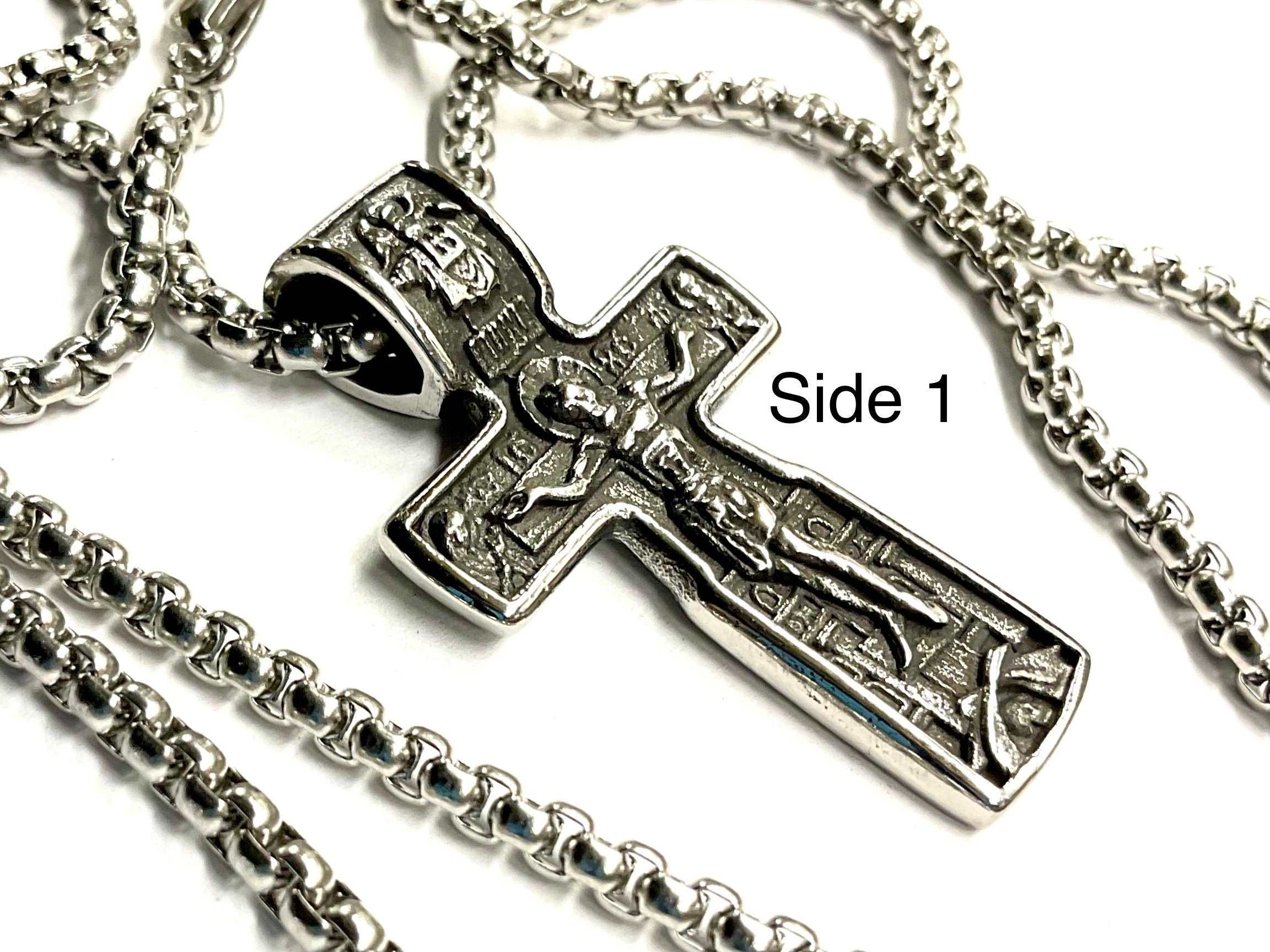 Silver crucifix cross pendant necklace with ornate panel detailing and chain links