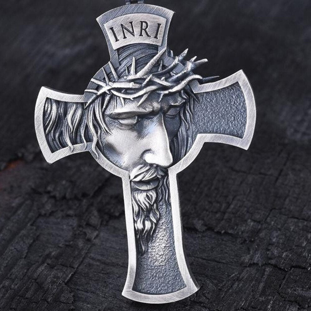 Silver-tone cross pendant with Jesus head profile, crown of thorns, and INRI panel