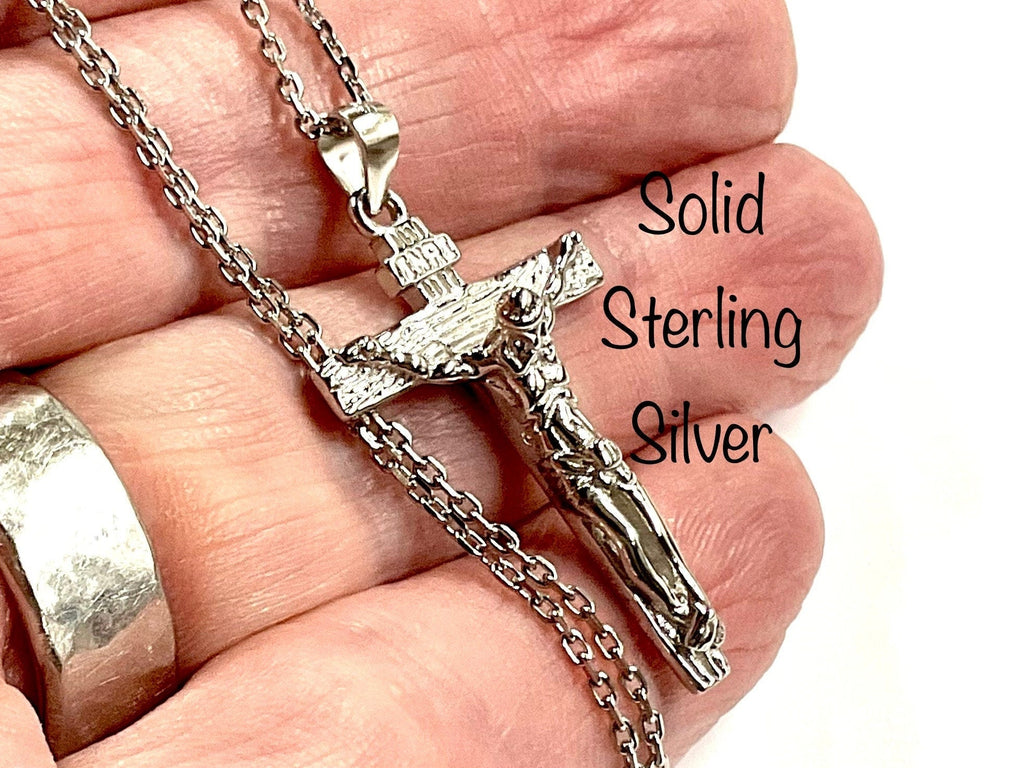 Sterling silver crucifix pendant and chain clasp, detailed Jesus figure close-up