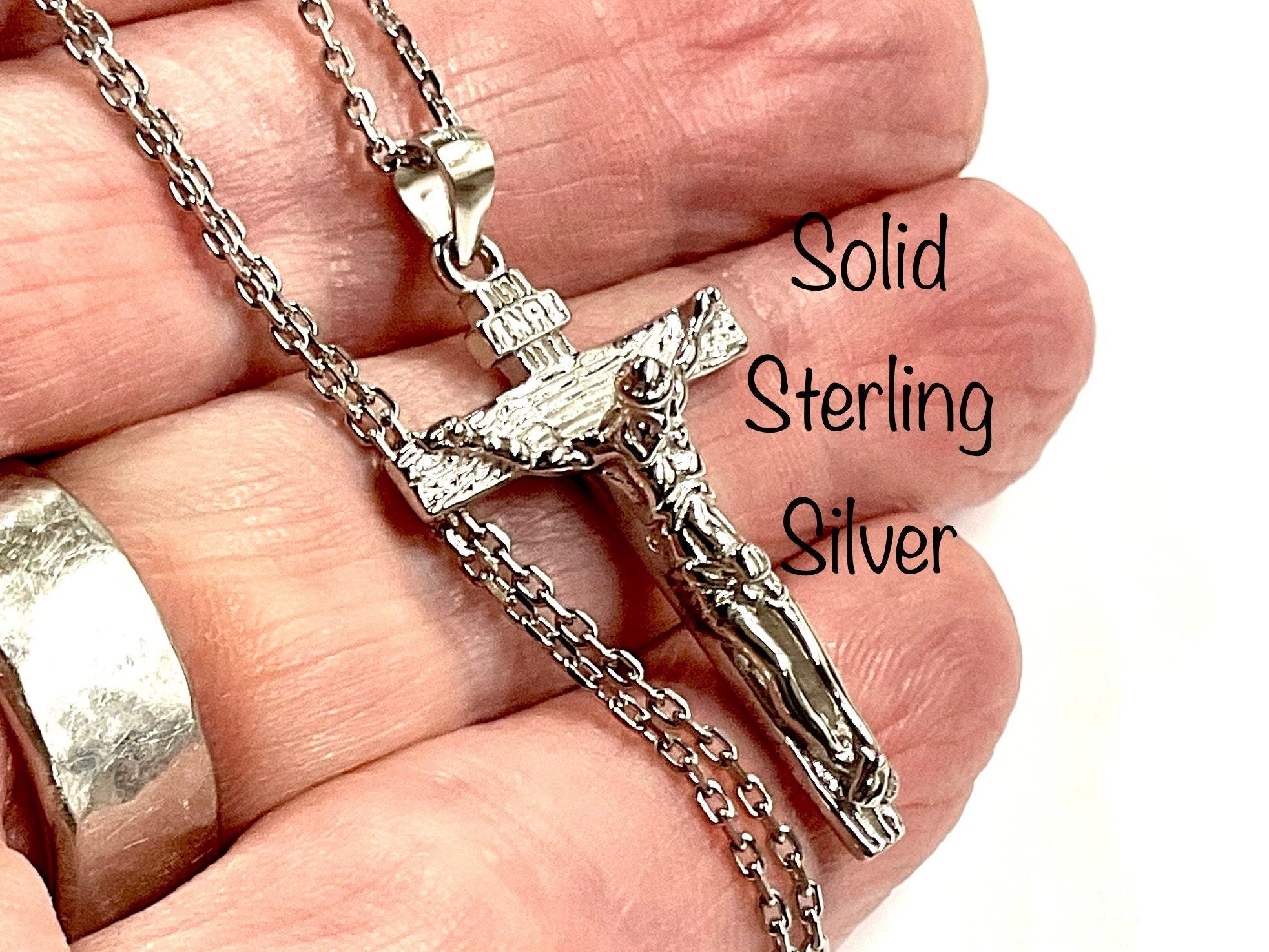 Sterling silver crucifix pendant and chain clasp, detailed Jesus figure close-up