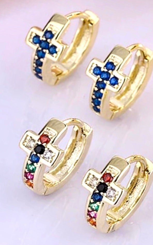Gold cuff cross earrings with blue sapphire-style stones, hinged small hoops