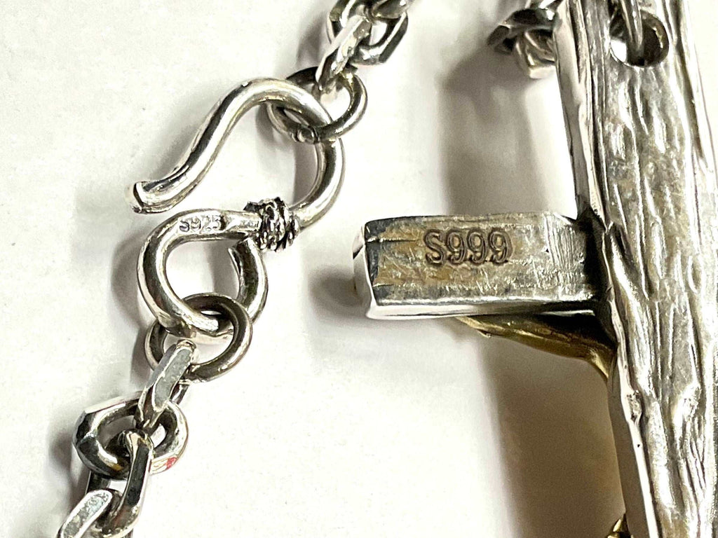 Sterling silver chain clasp stamped S925 and attached crucifix pendant