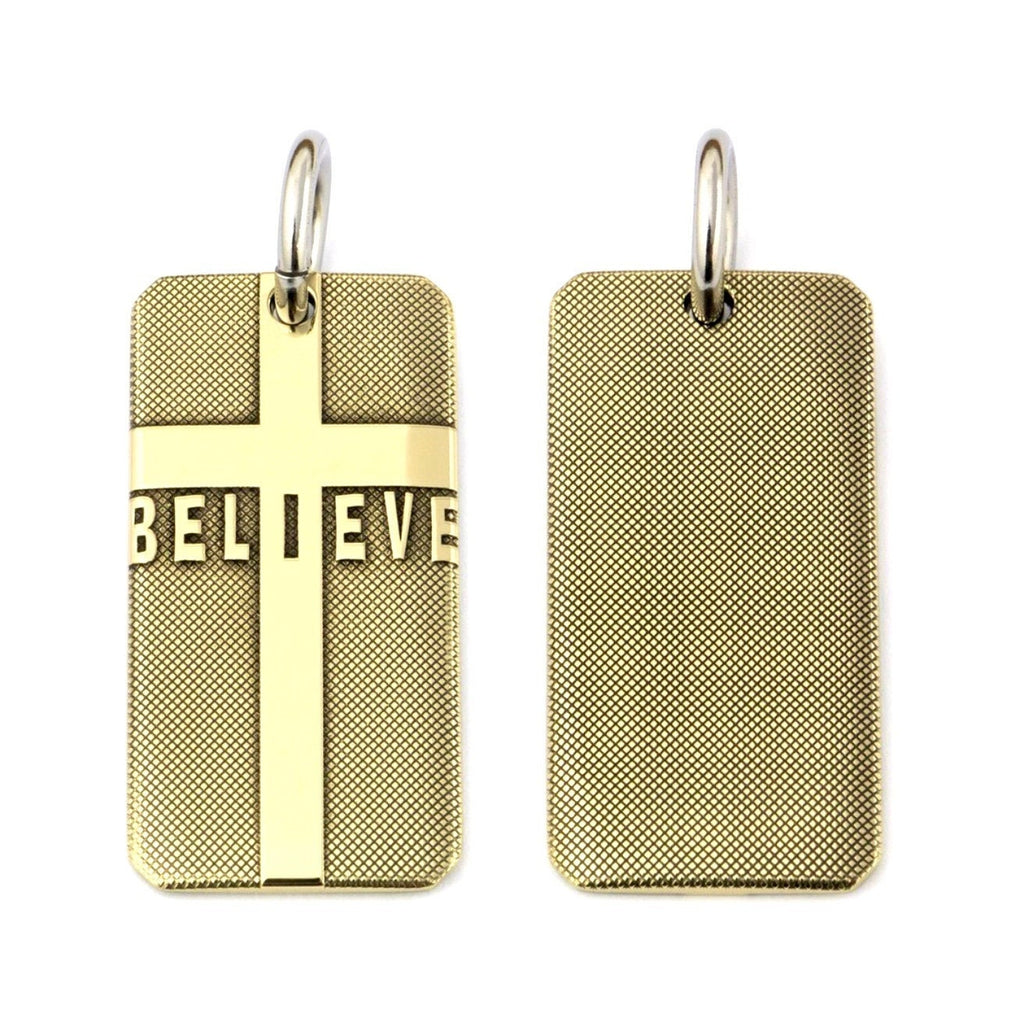 Gold-tone dog tag cross pendant pair: front shows cross with 'BELIEVE' text