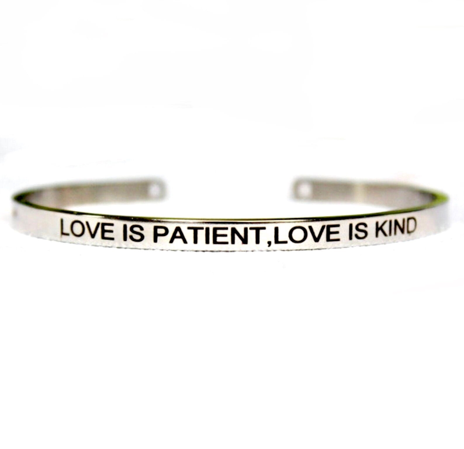 Stainless steel cuff bracelet with engraved "LOVE IS PATIENT, LOVE IS KIND"