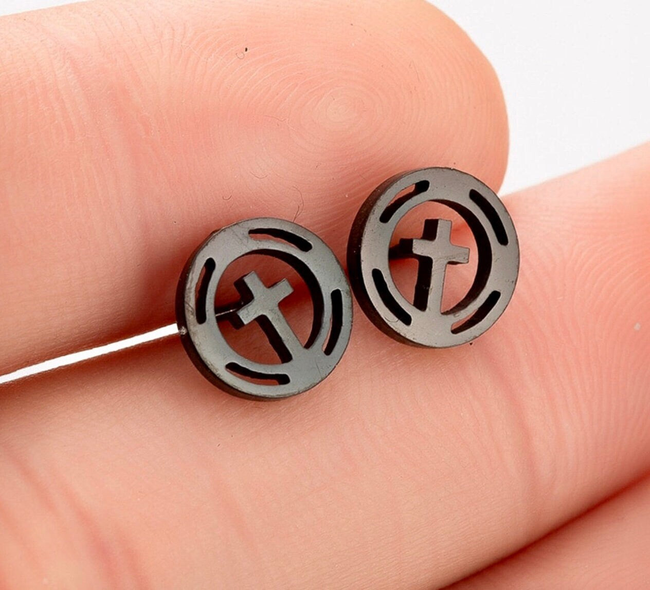 Round cross stud earrings with black and silver circle design, metal posts
