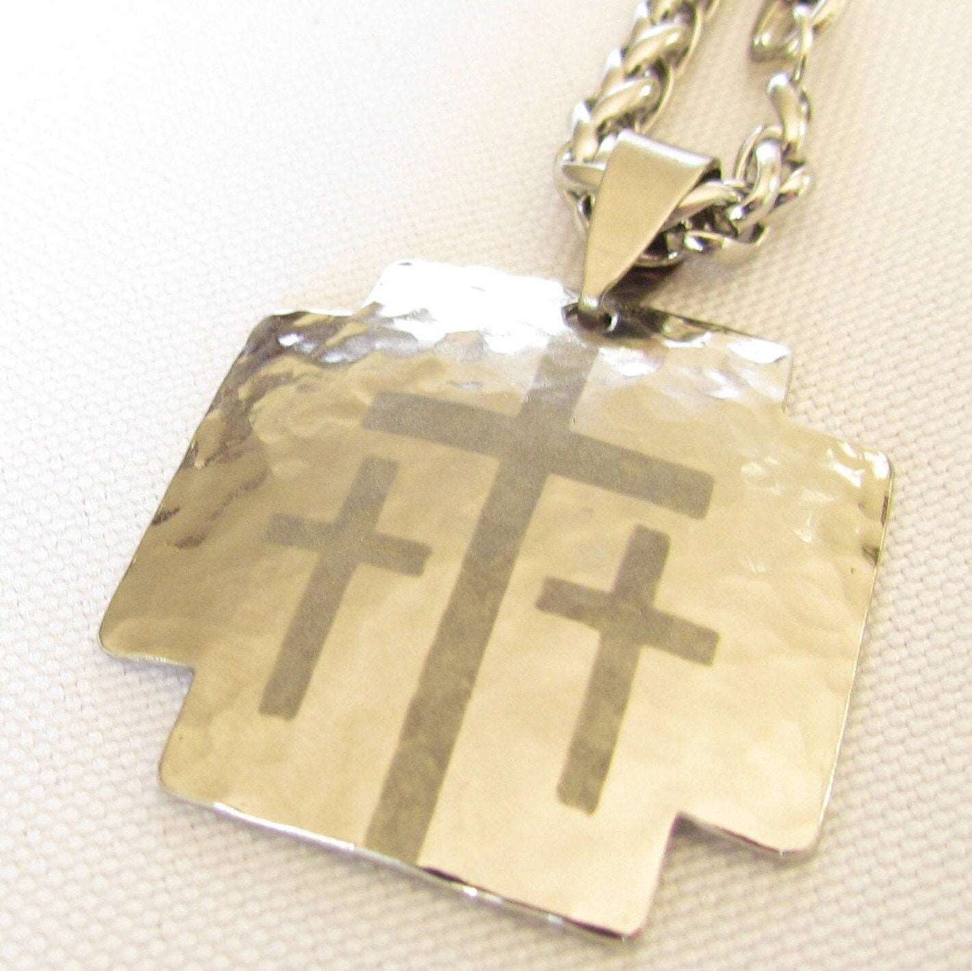 Hammered gold-tone dog tag pendant with triple cross design on chain