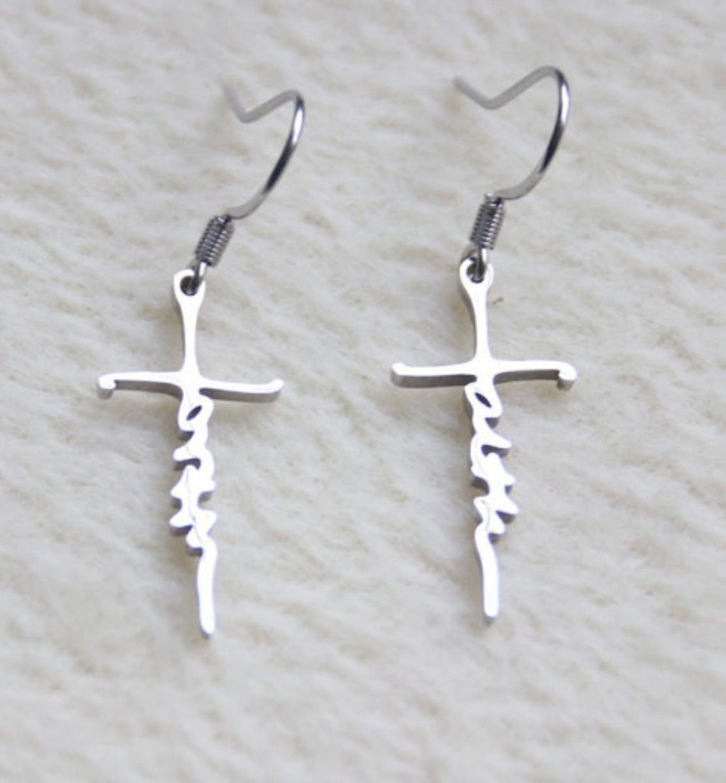 Silver cross dangle earrings with script cutout on vertical bar