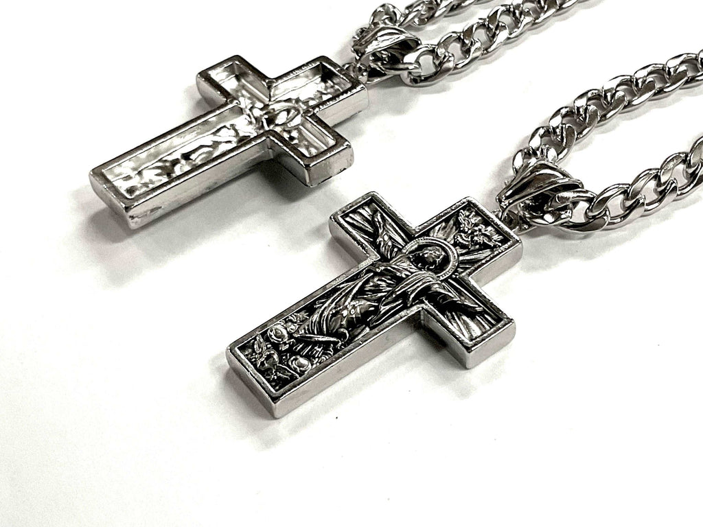Antiqued silver crucifix pendant necklace on box chain, angled view with Jesus figure