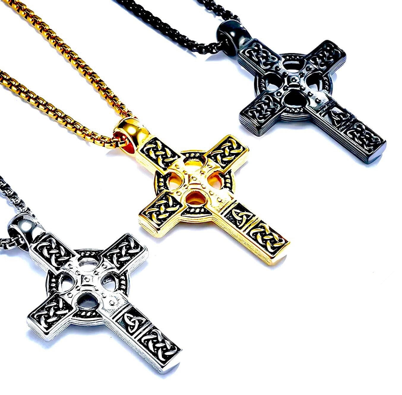 Celtic cross pendant necklace with braided link chain and ornate knotwork detail