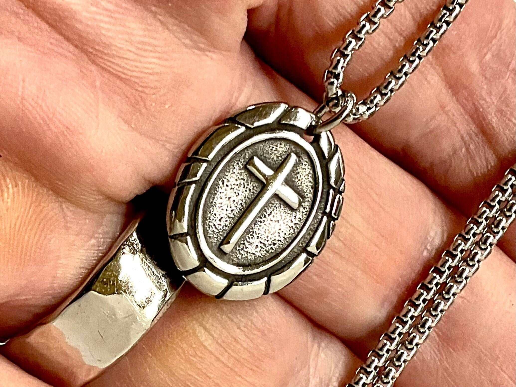Oval cross pendant necklace with textured silver-tone medal and box chain