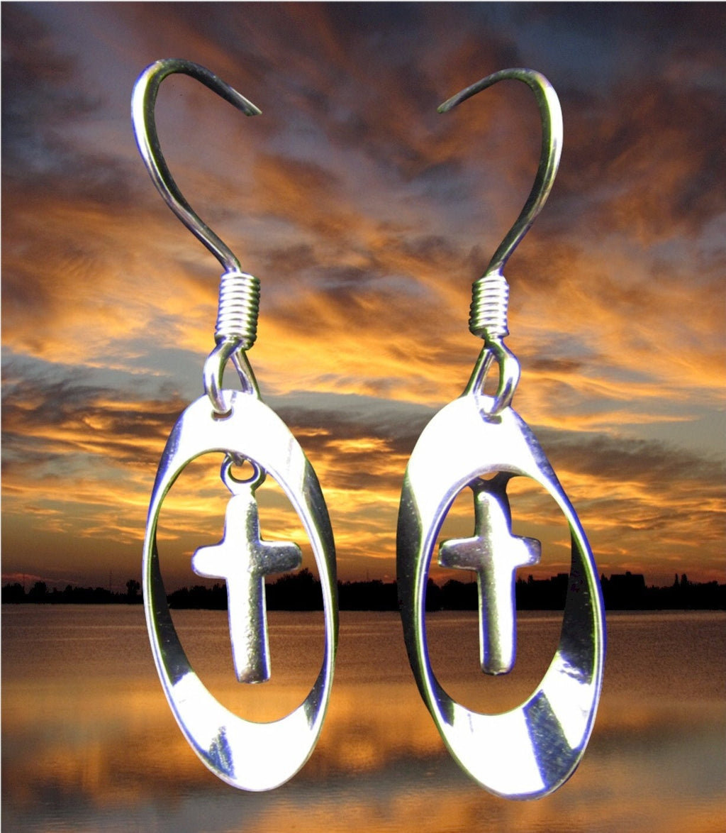 Silver oval drop earrings with cross charms and spiral hook tops